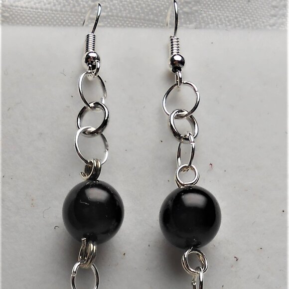 No.719 Handmade earrings with leather pieces 2 1/2 inches long - Picture 4 of 4